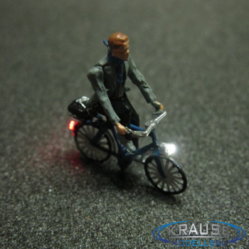 Figur 1:87 Mann mit Schaal auf Fahrrad mit LED Beleuchtung