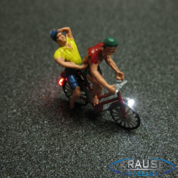 Figur 1:87 zwei Personen auf Fahrrad mit LED Beleuchtung
